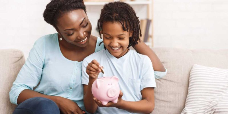 A mother teaching her daughter about financial planning